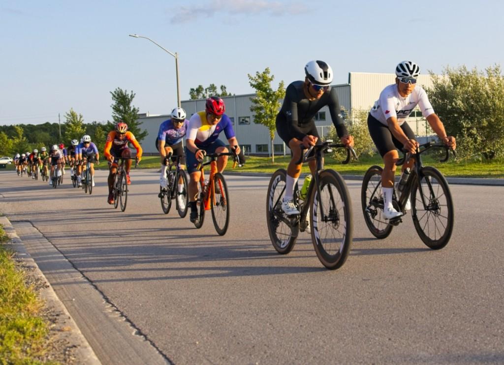 A line of criterium racers stretched out along the Uxbridge course